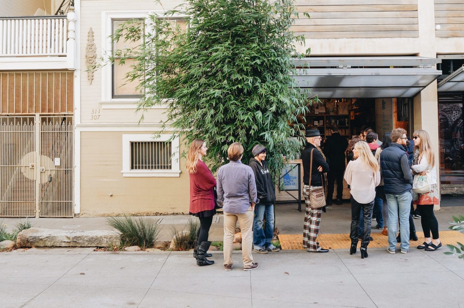 A line forms outside of Blue Bottle Coffee on Linden Street in Hayes Valley, San Francisco