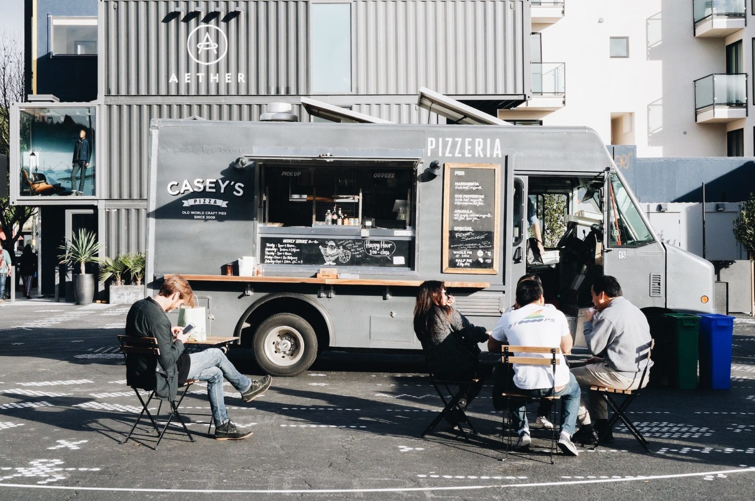 People gather and enjoy food from food trucks in Hayes Valley's PROXY